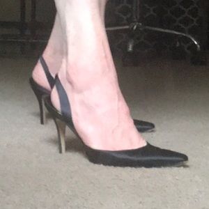 Manolo Blahnik black slingback heels.